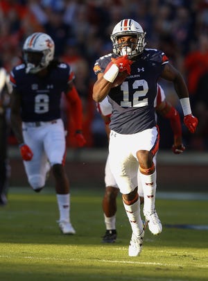 Auburn wide receiver Eli Stove, a Niceville graduate, breaks away for a touchdown against Arkansas on Saturday. AP Photo/Butch Dill