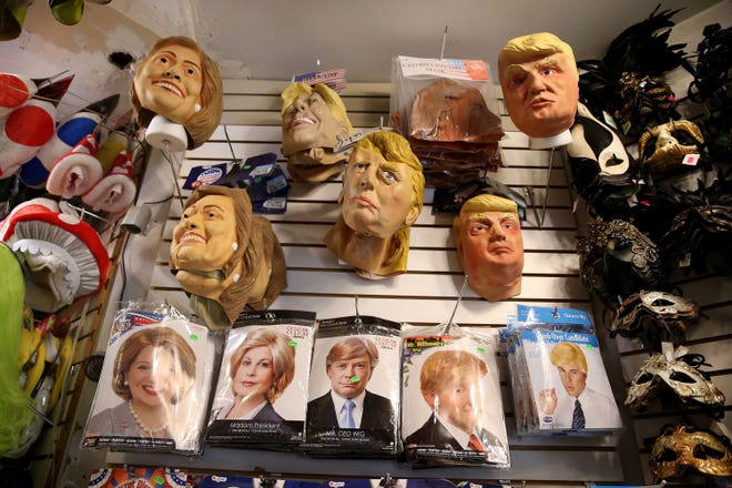 Hillary Clinton and Donald Trump costumes on display at a costume store. Superheroes and current media figures including politicians are hot costumes this year.