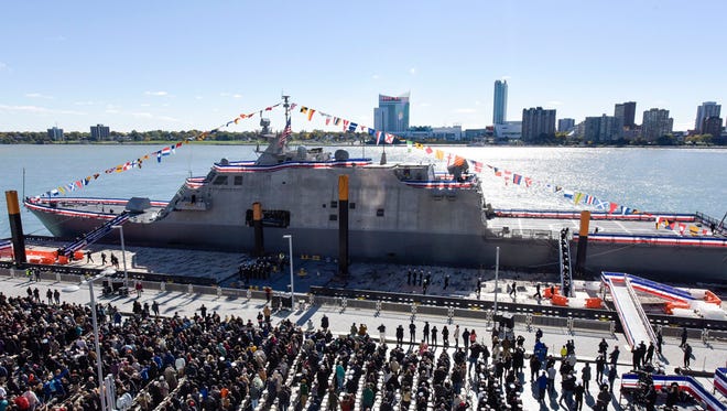 A crowd gathers on the dock Saturday on the Detroit River at a ceremony for the commissioning of the USS Detroit, a littoral combat ship that will eventually be based at Mayport Naval Station. (Lockheed Martin)