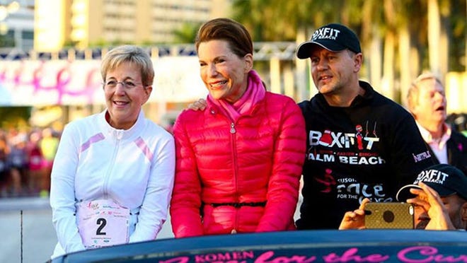 Nancy Brinker of Palm Beach, center, rides in a convertible at the start of the Komen South Florida Race for the Cure in downtown West Palm Beach in January. Send suggestions for other Community Profiles to feedback@pbdailynews.com. (Richard Graulich / The Palm Beach Post)