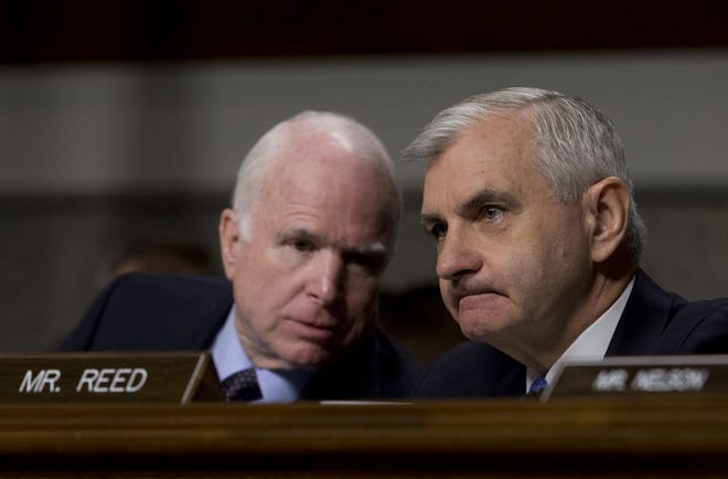Senate Armed Services Committee Chairman Sen. John McCain, R-Ariz., left, talks with the committee's ranking member Sen. Jack Reed, D-R.I., during the Senate Armed Services Committee hearing on Capitol Hill in Washington, Tuesday, July 7, 2015, about Counter-ISIL (Islamic State of Iraq and the Levant) Strategy.