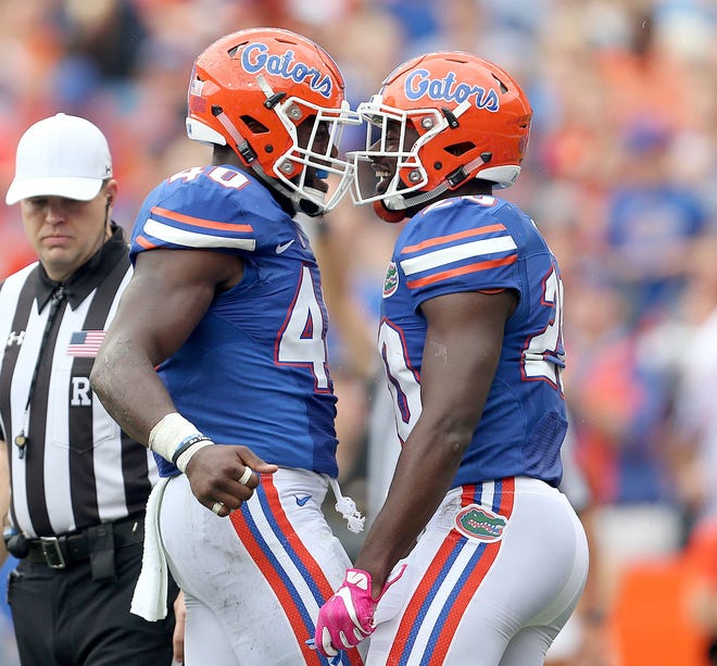 Florida linebacker Jarrad Davis, left, and safety Marcus Maye celebrate after a play against Missouri earlier this month at The Swamp. The seniors have produced leadership and big plays in their senior season. (Matt Stamey/Gainesville Sun correspondent)