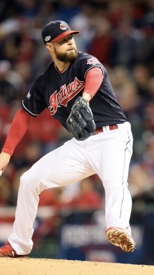 Corey Kluber has gone 2-1 with a 0.98 ERA for the Indians in the postseason. (Michael Chritton Akron Beacon Journal)