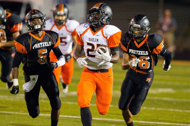 Harlem's Brenton Shaw, shown against Freeport, broke the NIC-10 career rushing record last week and needs 33 yards in the first round of the playoffs this week to become the fourth NIC-10 player to rush for 1,700 yards in a season. CHRIS ANDERSON /CORRESPONDENT/RRSTAR.COM & THE JOURNAL-STANDARD