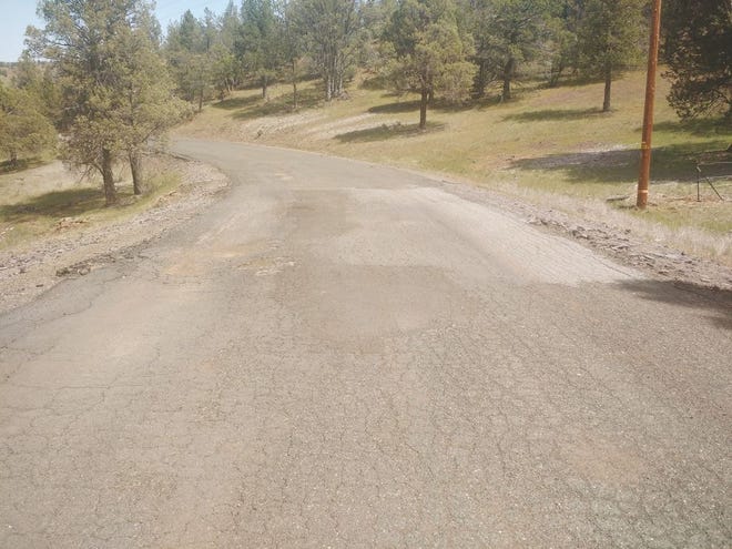 Tarpon Road, above, is one of many roads in the Klamath River Country Estates area that residents fear have become dangerous to drive on due to pot holes and other deterioration.