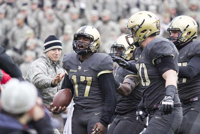 Army quarterback Ahmad Bradshaw (left) celebrates scoring a touchdown against North Texas, a rare highlight in the Black Knights' seven-turnover game on Saturday. Now they face a good Wake Forest team and are in desperate need of a victory. JOSH CONKLIN/FOR THE TIMES HERALD-RECORD