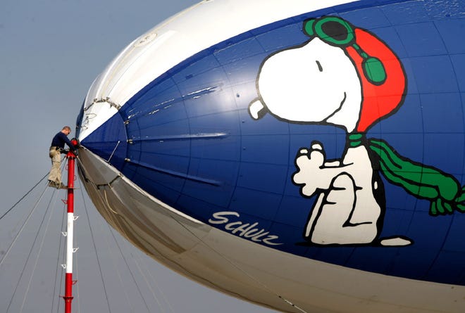 Charles Schulz's Snoopy, from the "Peanuts" gang, adorning the MetLife company blimp
