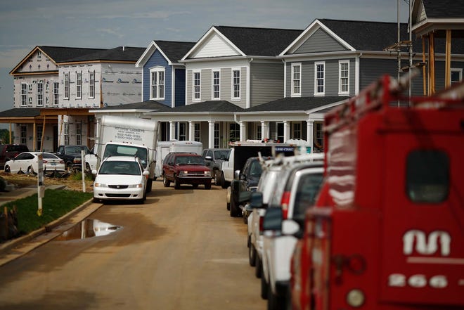 Newly constructed houses stand in the Norton Commons subdivision of Louisville, Kentucky, in May. LUKE SHARRETT/ Bloomberg