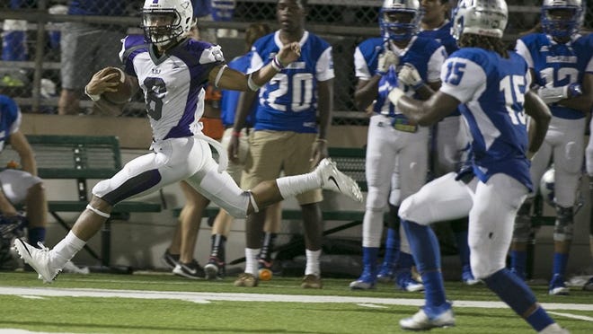 LBJ's Brian Batts races down the sideline for a large gain in second quarter action but was called for a personal fouls penalty at the end of the play to lose 15 yards. The LBJj Jaguars raced out to a 14-3 halftime lead over their district rival McCallum Knights at House Park Friday night September 23, 2016. RALPH BARRERA/AMERICAN-STATESMAN