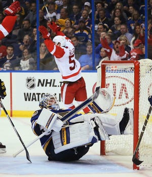 Detroit Red Wings center Frans Nielsen, background, reacts after scoring a short handed goal against St. Louis Blues goaltender Jake Allen in the second period of an NHL hockey game Thursday, Oct. 27, 2016, in St. Louis. (Chris Lee/St. Louis Post-Dispatch via AP)