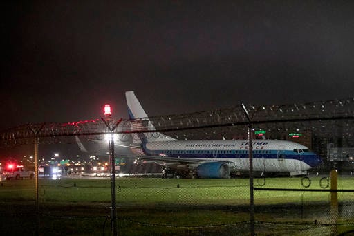 Republican vice presidential candidate Indiana Gov. Mike Pence's campaign airplane sits partially on the tarmac and the grass after sliding off the runway while landing at LaGuardia airport, Thursday, Oct. 27, 2016, in New York. (AP Photo/Mary Altaffer)