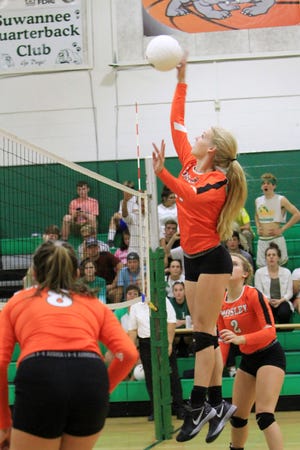 Mosley's Olivia Whittle hits at the net. SPECIAL TO THE NEWS HERALD