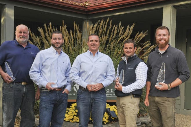 Brad Haven (far left), of Barnstable, recently won a Silver Award for Customer Service Professional of the Year award, in connection with his work for The Valle Group, builders on Cape Cod who constructed Redbrook in Plymouth, a prize-winning mixed-used community development. The 2016 PRISM awards recognize outstanding achievements in the home building industry. COURTESY PHOTO