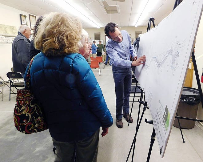 Mark Carabetta, of Milone & MacBroom Inc., reviews drawings of plans for the Fulmer Creek Greenplain Project with some of the residents who attended an informational session in Mohawk Thursday evening. TIMES TELEGRAM PHOTO/DONNA THOMPSON