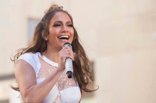 FILE - In this July 11, 2016 file photo, Jennifer Lopez performs on NBC's "Today" show at Rockefeller Plaza in New York.  NBC says the actress-singer will headline its 2017 live holiday musical. She will play Rosie, the role originated on Broadway in 1960 by Chita Rivera. “Bye Bye Birdie Live!” airs a year from now as the next in NBC's annual live-musical tradition. “Hairspray Live!,” starring newcomer Maddie Baillio, is set to air Dec. 7. (Photo by Charles Sykes/Invision/AP)