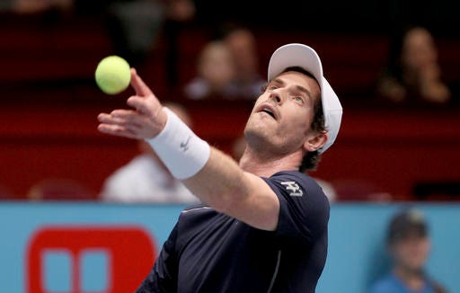 Andy Murray of Great Britain serves the ball to John Isner of the United States during their quarter final match at the Erste Bank Open tennis tournament in Vienna, Austria, Friday, Oct. 28, 2016. (AP Photo/Ronald Zak)