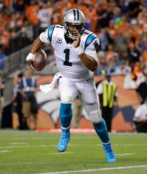 FILE - In this Sept. 8, 2016, file photo, Carolina Panthers quarterback Cam Newton (1) runs against the Denver Broncos during the first half of an NFL football game, in Denver. The Panthers face the Cardinals this week. Newton only ran twice against the Saints in his first game back from a concussion, but said this week he won’t let the head injury affect how he approaches the game moving forward. (AP Photo/Jack Dempsey, File)