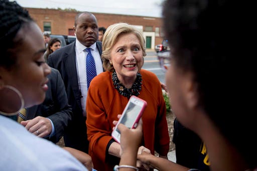 Democratic presidential candidate Hillary Clinton greets early voters at the Leonard J. Kaplan Center for Wellness at the University of North Carolina at Greensboro in Greensboro, N.C., Thursday, Oct. 27, 2016. (AP Photo/Andrew Harnik)