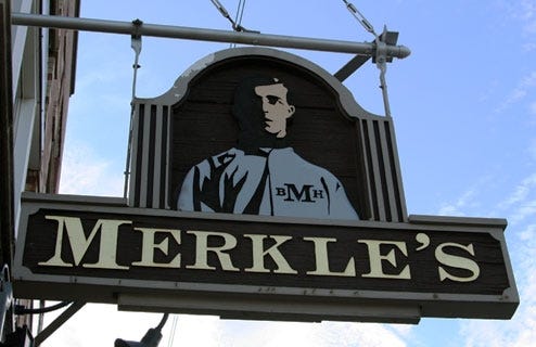 The sign above Merkle's bar, a block south of Wrigley Field.