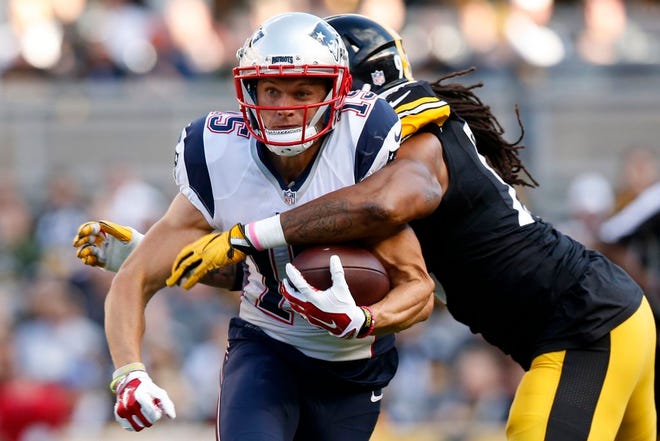 New England Patriots wide receiver Chris Hogan (15) is hit by Pittsburgh Steelers outside linebacker Jarvis Jones (95) to force a fumble during the first half of an NFL football game in Pittsburgh, Sunday, Oct. 23, 2016. (AP Photo/Jared Wickerham)