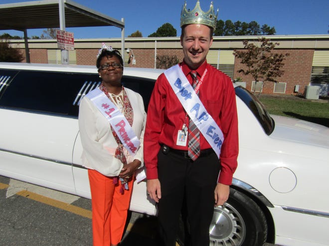 From left to right, Belmont Central Elementary Principal Phyllis Whitworth and Assistant Principal Todd Goff pose in front of the limousine that staffers arranged to take them to an all-expenses paid lunch at Nellie’s Southern Kitchen in downtown Belmont on Friday. Photo courtesy of Gaston County Schools.