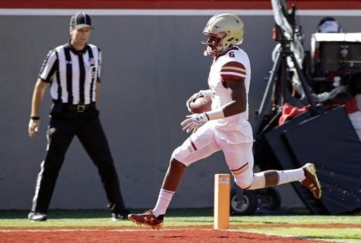 Boston College wide receiver Jeff Smith scores a touchdown against North Carolina State during the first half of BC's 21-14 win in Raleigh, N.C. on Saturday. AP PHOTO/GERRY BROOME