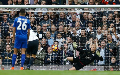 Leicester City's goalkeeper Kasper Schmeichel fails to save a penalty taken by Tottenham Hotspur's Vincent Janssen during the English Premier League soccer match between Tottenham Hotspur and Leicester City at the White Hart Lane stadium in London in London, Saturday, Oct. 29, 2016. (AP Photo/Alastair Grant)