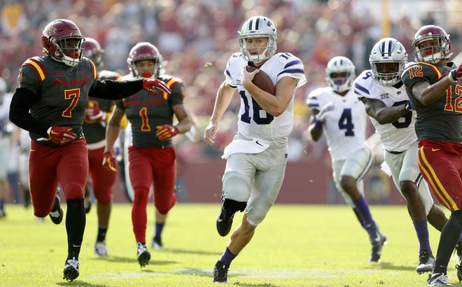 K-State quarterback Jesse Ertz eludes the Iowa State defense for a 54-yard first-quarter gain that set up a Matthew McCrane field goal to open the game’s scoring. Ertz led all rushers with 106 yards on nine carries and threw for 151 yards and a touchdown.