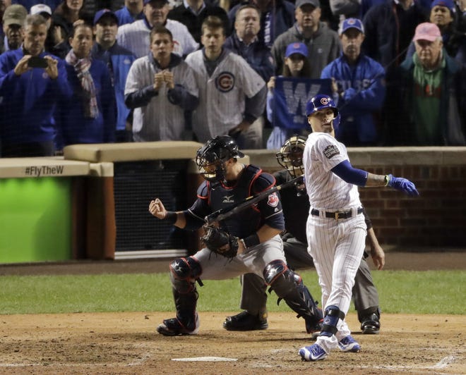 Cleveland Indians catcher Yan Gomes, left, celebrates after Chicago Cubs' Javier Baez makes the final out in Game 3 of the Major League Baseball World Series Friday, Oct. 28, 2016, in Chicago. The Indians won 1-0 to take a 2-1 lead in the series. THE ASSOCIATED PRESS / CHARLIE RIEDEL