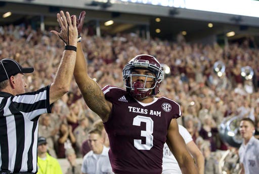 Texas A&M's Christian Kirk (3) celebrates a touchdown against New Mexico State during the second quarter of an NCAA college football game Saturday, Oct. 29, 2016, in College Station, Texas. (AP Photo/Sam Craft)