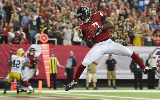 Atlanta Falcons wide receiver Mohamed Sanu (12) makes a touchdown catch against the Green Bay Packers during the fourth quarter of a game Sunday, Oct. 30, 2016, in Atlanta. The Atlanta Falcons won 33-32. (Rainier Ehrhardt/AP Photo)