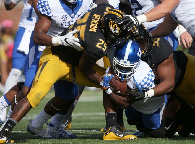 Missouri linebacker Donavin Newsom makes a tackle during Saturday's game against Kentucky. Newsom strained his quad during the first quarter and sat out the remainder of the game. Coach Barry Odom said Monday that Newsom is "still pretty sore," and his status for Saturday's game at South Carolina is uncertain. Newsom leads Missouri with 55 tackles.