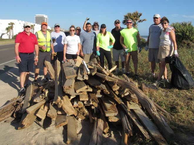 Flagler Beach City Manager Larry Newsom joined volunteers from Flagler Beach, Palm Coast, Bunnell and DeLand to help clean up the beaches in northern Flagler Beach on Saturday. Another volunteer beach cleanup also is planned for this Saturday. NEWS-JOURNAL/DANIELLE ANDERSON