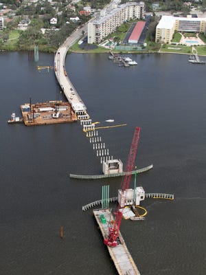 Large cranes and barges surround the Orange Avenue Bridge as work continues, Thursday October 13, 2016.    News-Journal/David Tucker
