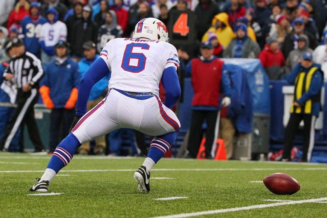 Buffalo Bills punter Colton Schmidt loses control of the ball during the second half of an NFL football game against the New England Patriots Sunday, Oct. 30, 2016, in Orchard Park, N.Y. He picked up the ball and ran for a first down.