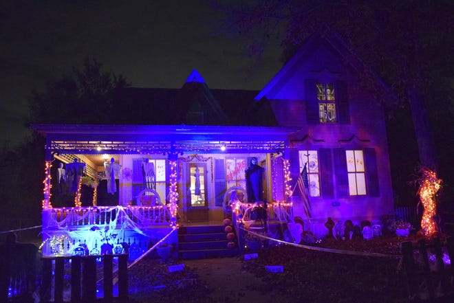 In an Oct. 19, 2016 photo, a Tillson Street house is decorated for Halloween in Romeo, Mich. The generally quiet street with historic homes is transformed by homeowners with great imaginations and a passion for the creepy, kooky and altogether spooky. (Gina Joseph/The Macomb Daily via AP)