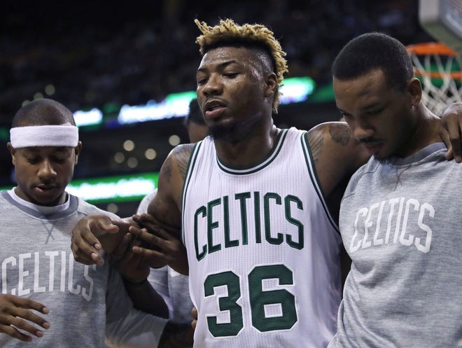 After losing guard Marcus Smart (36) with a sprained ankle in their preseason finale, the Celtics are hoping to have Smart back for Wednesday night's game against the Bulls at TD Garden.