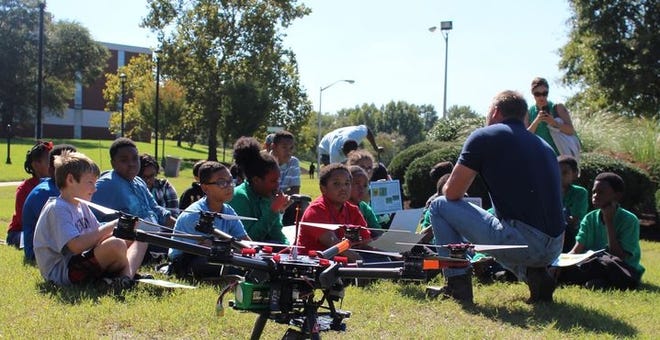 Bob Waring, a farmer from Tappahannock, leads a session for young 4-H'ers on drones. The 4-H Kids Tech University participants learned how technology and science help produce food and they were given the opportunity to fly the drone. Contributed Photo