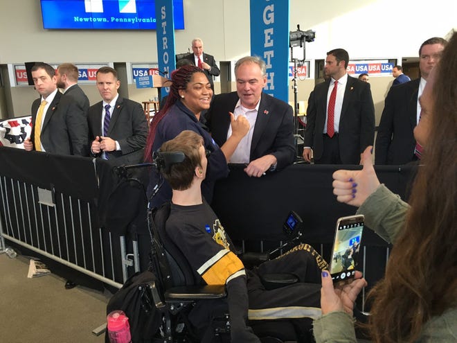 U.S. Sen. Tim Kaine, D-Va., the Democratic nominee for vice president,  speaks with a supporter Wednesday at Bucks County Community College in Pennsylvania.