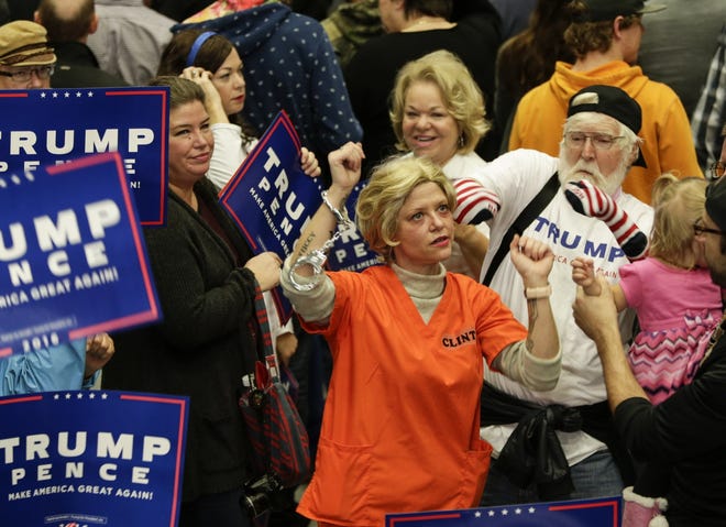 Members of the crowd dance Monday to music as they wait for Republican presidential candidate Donald Trump to speak during a campaign rally in Grand Rapids, Michigan. AP Photo/Nati Harnik