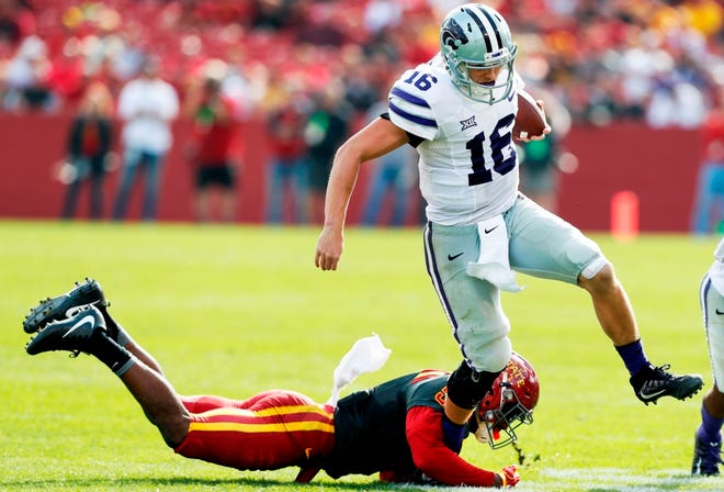 Kansas State quarterback Jesse Ertz (16) breaks a tackle by Iowa State defensive back Kamari Cotton-Moya during the second half of an NCAA college football game, Saturday, Oct. 29, 2016, in Ames, Iowa. After Kansas State escaped with a 31-26 victory at Iowa State last Saturday, coach Bill Snyder found only one positive.
"The final score," Snyder said after K-State was outscored 16-0 in the fourth quarter.