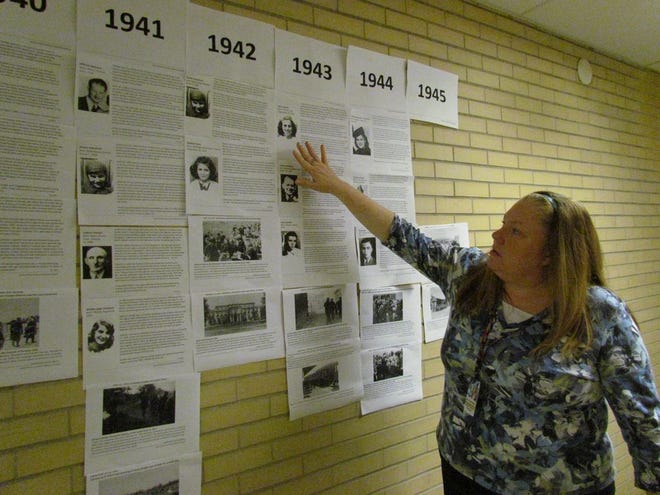 Alecha Sanbower explains the Holocaust timeline created by her STRIVE Academy alternative education students at Waynesboro Area Senior High School. The WASHS world history and economics teacher attended training for educators this summer at the U.S. Holocaust Museum.