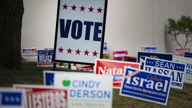 Candidate signs outside an early voting location at ACC-Highland Mall.