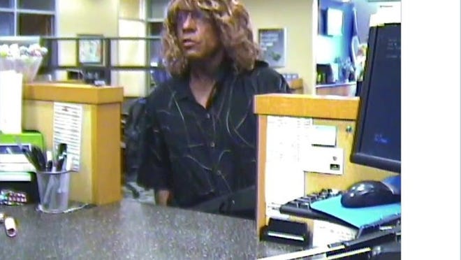 Georgetown police say this person wearing a blond wig robbed a Capital One Bank branch in Georgetown on Tuesday. (Georgetown Police Department)