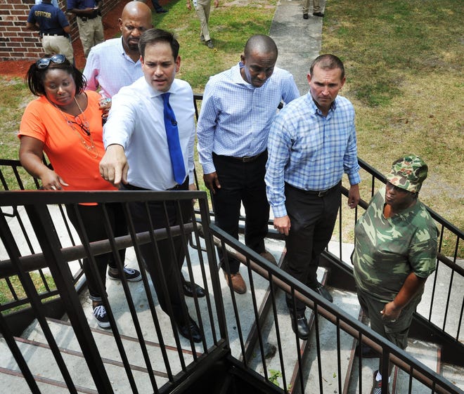 Sen. Marco Rubio toured Eureka Garden last May along with city officials and residents. He called the owners, Global Ministries Foundation, slumlords. (Will Dickey/Florida Times-Union)