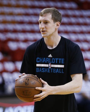 This April 27, 2016 photo shows Charlotte Hornets center Cody Zeller shooting the ball as he warms up before the start of Game 5 of an NBA basketball playoffs first-round series against the Miami Heat in Miami. A person familiar with the deal says Zeller has agreed to a four-year, $56 million contract extension with the Charlotte Hornets. The person spoke to The Associated Press on Monday, Oct. 31, 2016 on condition of anonymity because the move hasn't been announced. (AP Photo/Wilfredo Lee)