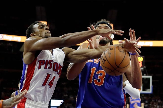 Detroit Pistons guard Ish Smith (14) and New York Knicks center Joakim Noah (13) fight for the rebound during the second half of an NBA basketball game, Tuesday, Nov. 1, 2016, in Auburn Hills, Mich. (AP Photo/Carlos Osorio)