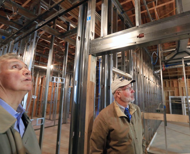 York Selectman Chair Robert Palmer, left, and York Police Chief Doug Bracy scan the site of the new police station as they move through the building during a tour on Thursday.

Photo by Ioanna Raptis/Seacoastonline