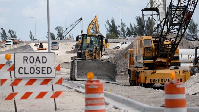 MIAMI, FL - FEBRUARY 02: Construction work is underway at the $559-million reconstruction project, some of which is being federally funded, at the interchange connecting State Road 826 and SR 836, one of the most heavily congested areas in Miami-Dade County, on February 2, 2015 in Miami, Florida. President Barack Obama announced his $4 trillion, 2016 budget on Monday, and is requesting $478 billion over six years to make significant repairs to the nations infrastructure and to build new bridges, roads, and railways. (Photo by Joe Raedle/Getty Images)