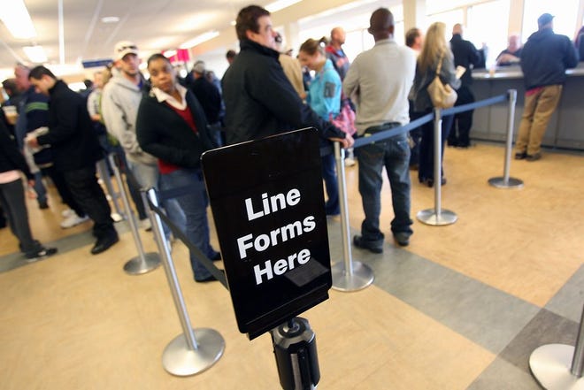 In this 2012 photo from the Cranston DMV office, patrons line up to conduct business.